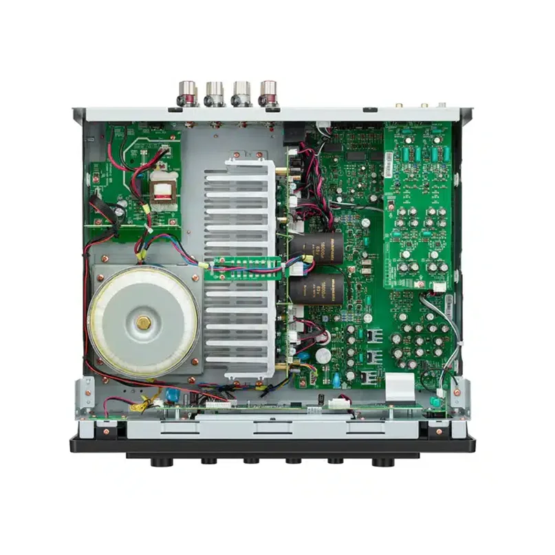 Marantz Model 50 Integrated Stereo Amplifier Open electronic equipment chassis showing a large transformer, metal cooling heatsink, and multiple green circuit boards.