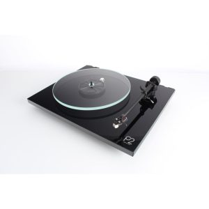 Turntable with black glossy base, turquoise ring on clear platter, tonearm and cartridge on right, f2 label on base.