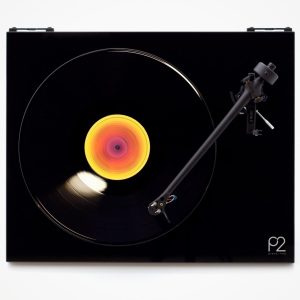 Planar Two turntable with black glossy plinth, tonearm on right, and rainbow-colored record label.