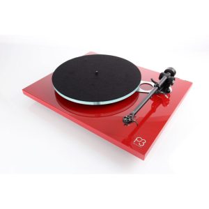 Pro-Ject P3 turntable with red gloss plinth, black platter mat, and tonearm with cartridge.