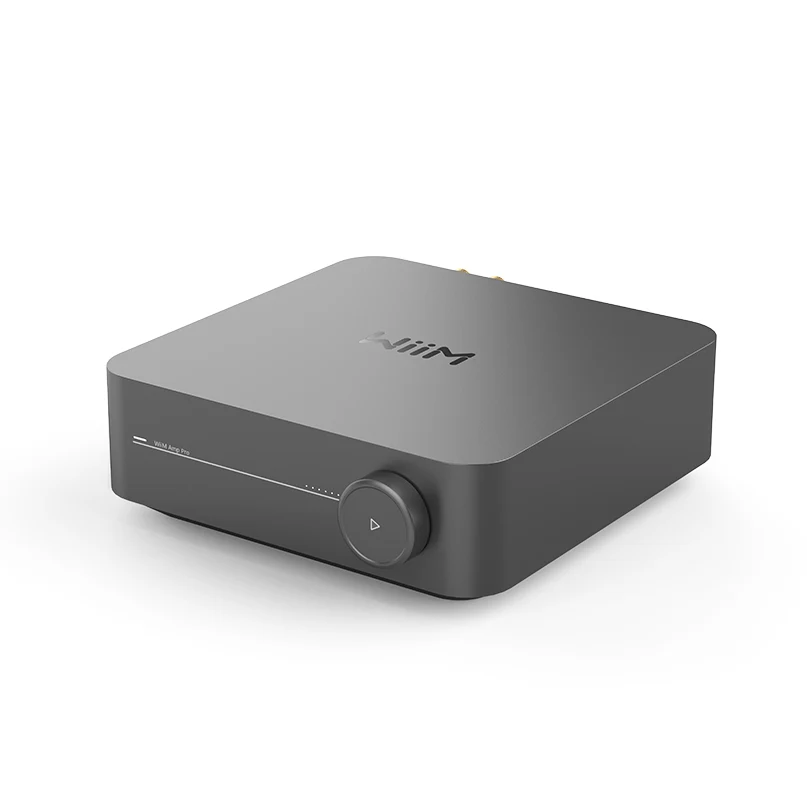 Wiim Amp Pro Multiroom Stereo Streaming Amplifier Naim compact audio amplifier with large front volume knob and slim led indicator line on dark gray chassis.