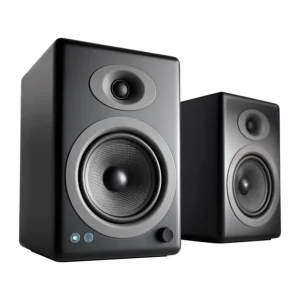 Pair of black bookshelf studio monitor speakers with large woofer, dome tweeter, and front LEDs.