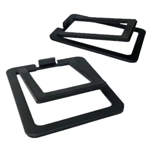 Pair of black rectangular bezel frames with square center openings; one has a small tab, suggesting mounting or alignment features.
