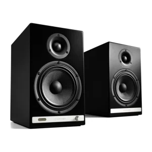 Pair of black bookshelf studio monitor speakers with dual drivers and front bottom control panel.