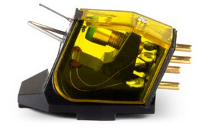 Phono cartridge with yellow translucent housing, visible stylus, and four gold connector pins.