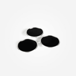Three round black discs with thin silver rims arranged in a triangle.