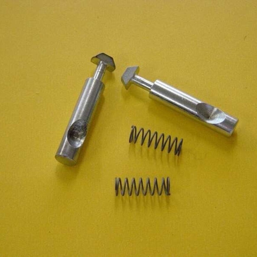 T Part Two steel spring plungers with square heads and two coil springs on a yellow background.