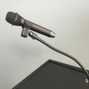 Desk-mounted dynamic microphone on a flexible gooseneck with clamp.