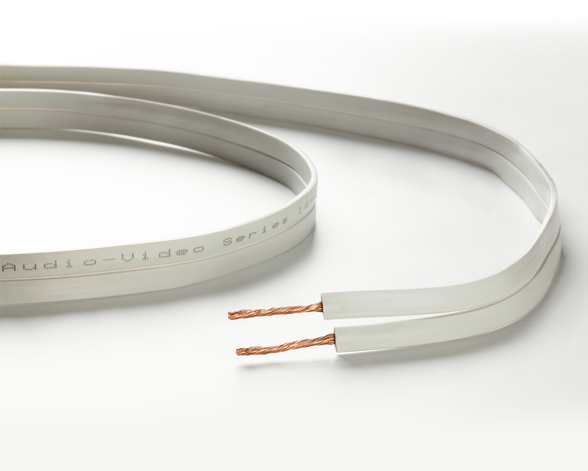 Taga Harmony Tavc-16Fg Flat white speaker cable with exposed copper strands at the ends.