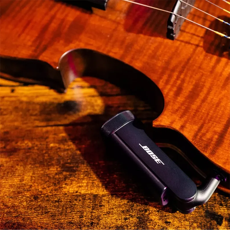 Bose Wireless Instrument Transmitter Bose clip-on microphone attached to the violin near the bridge.