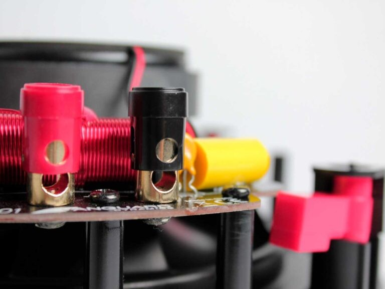 Tdg Audio Nfc-83A 8″ Angled In-Ceiling Speaker Close-up of red and black banana plug terminals mounted on a small printed circuit board.
