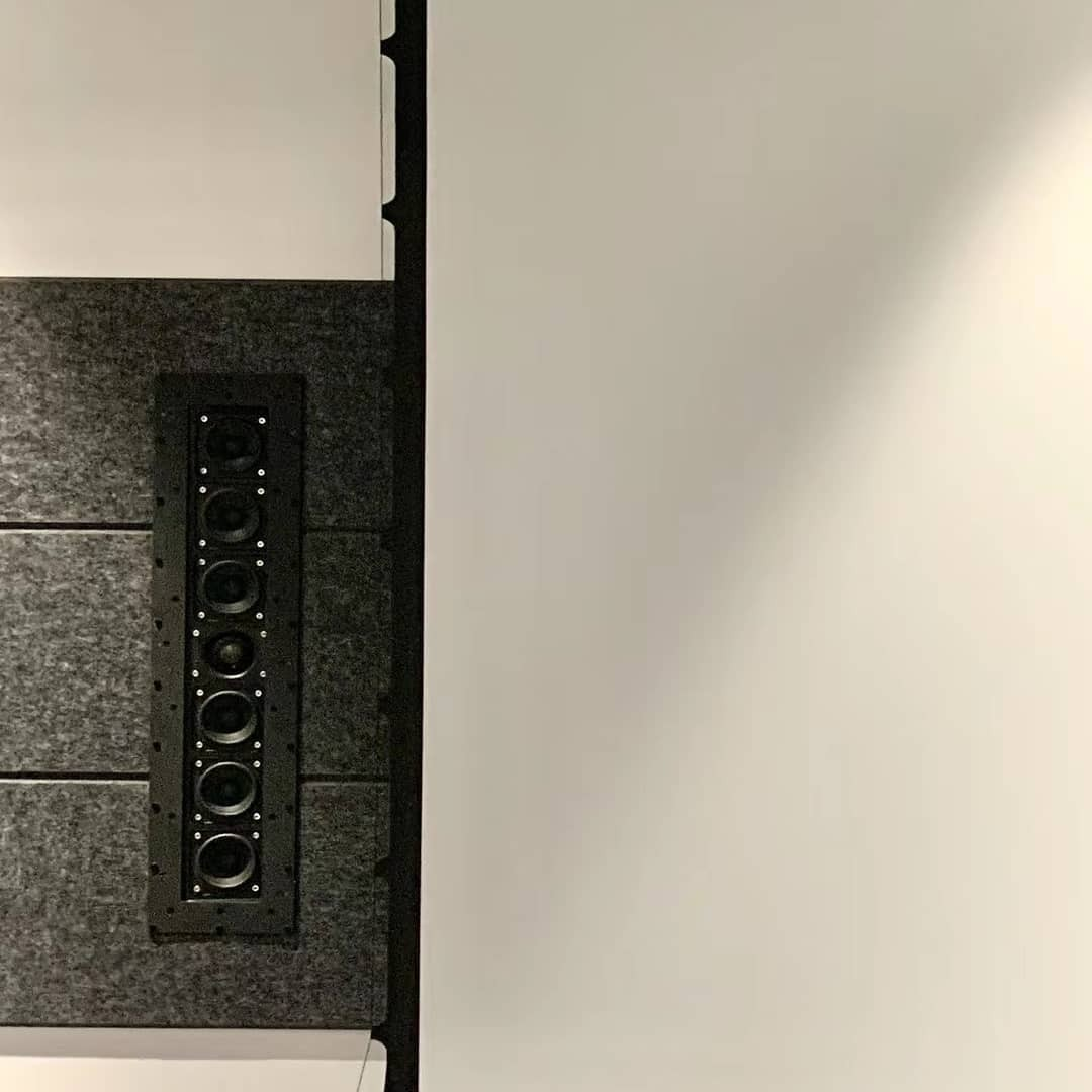Tdg Audio Skybar™ Lcr Architectural Soundbar Vertical wall-mounted multi-driver loudspeaker panel with multiple circular drivers in a black frame.
