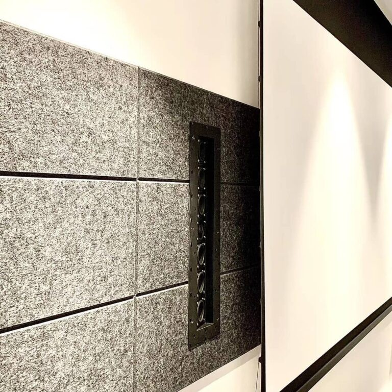 Tdg Audio Skybar™ Lcr Architectural Soundbar Vertical black electrical outlet strip with six round sockets mounted on a gray tiled wall.