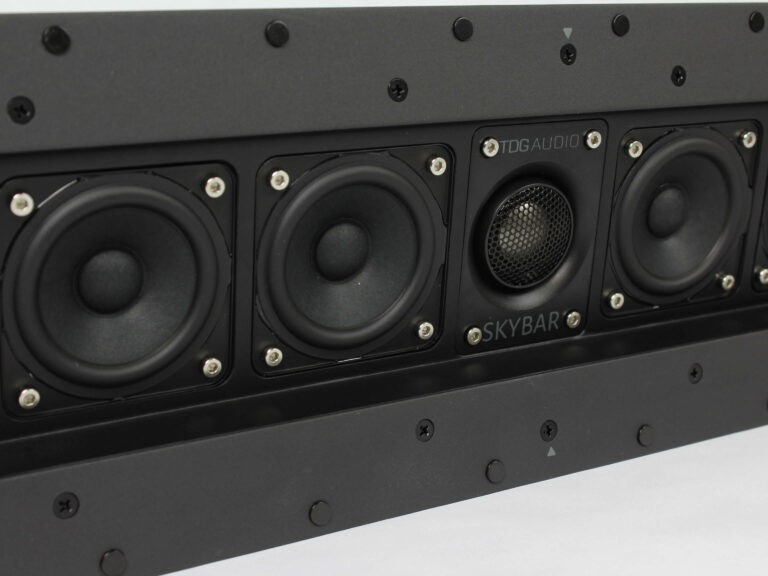 Tdg Audio Skybar™ Lcr Architectural Soundbar Tdgaudio skybar soundbar with four round drivers and central mesh tweeter in a black rectangular enclosure.