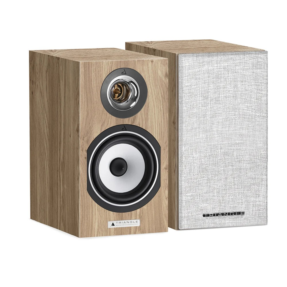 Triangle Audio Titus Ez Triangle bookshelf speakers with natural wood veneer front, visible tweeter and woofer, and a fabric grille on the second unit.
