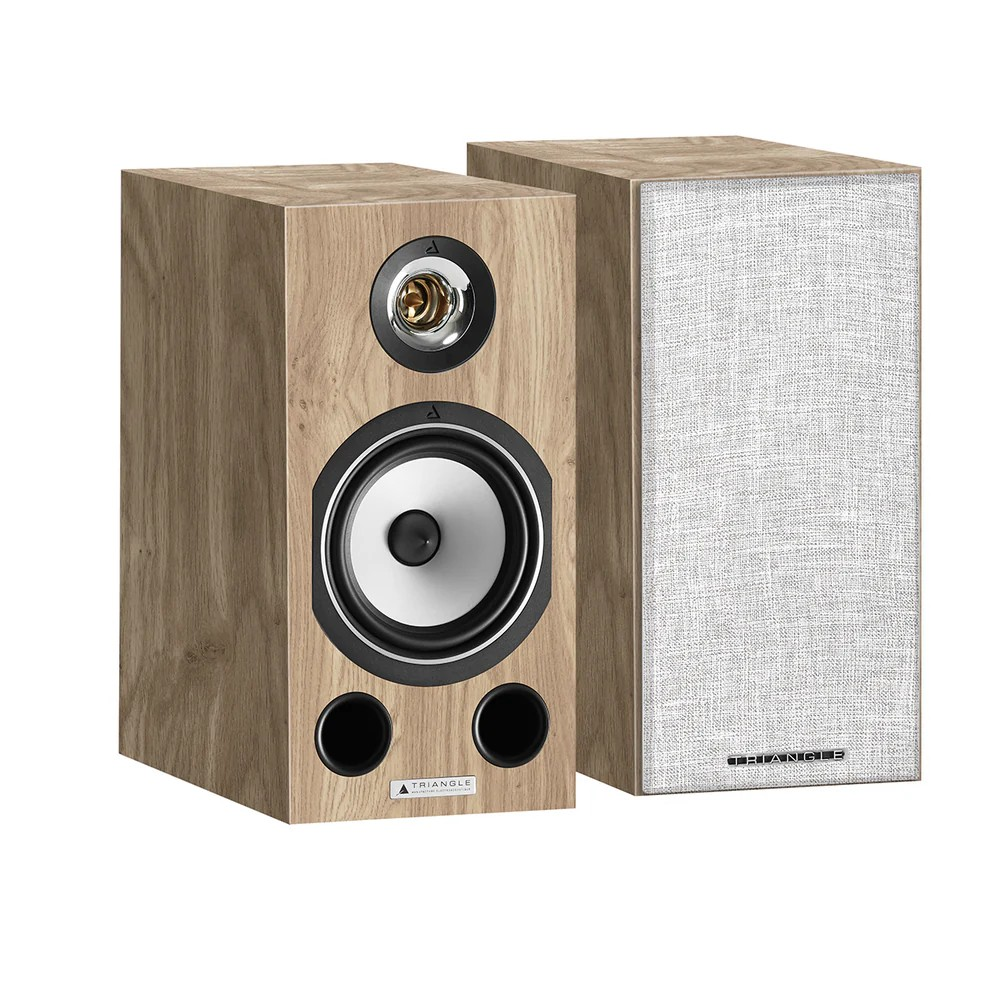 Triangle Comète Ez Triangle bookshelf speakers in wood veneer, one with exposed 1-inch tweeter and 6. 5-inch woofer, dual bass ports, removable fabric grille