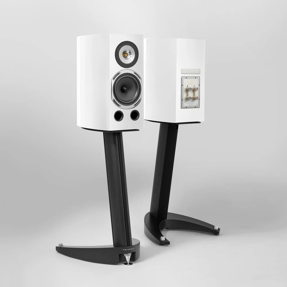 Triangle Magellan Duetto 40Th Premium Bookshelf Speaker Pair of white triangle bookshelf speakers on black curved stands, with rear panel binding posts.