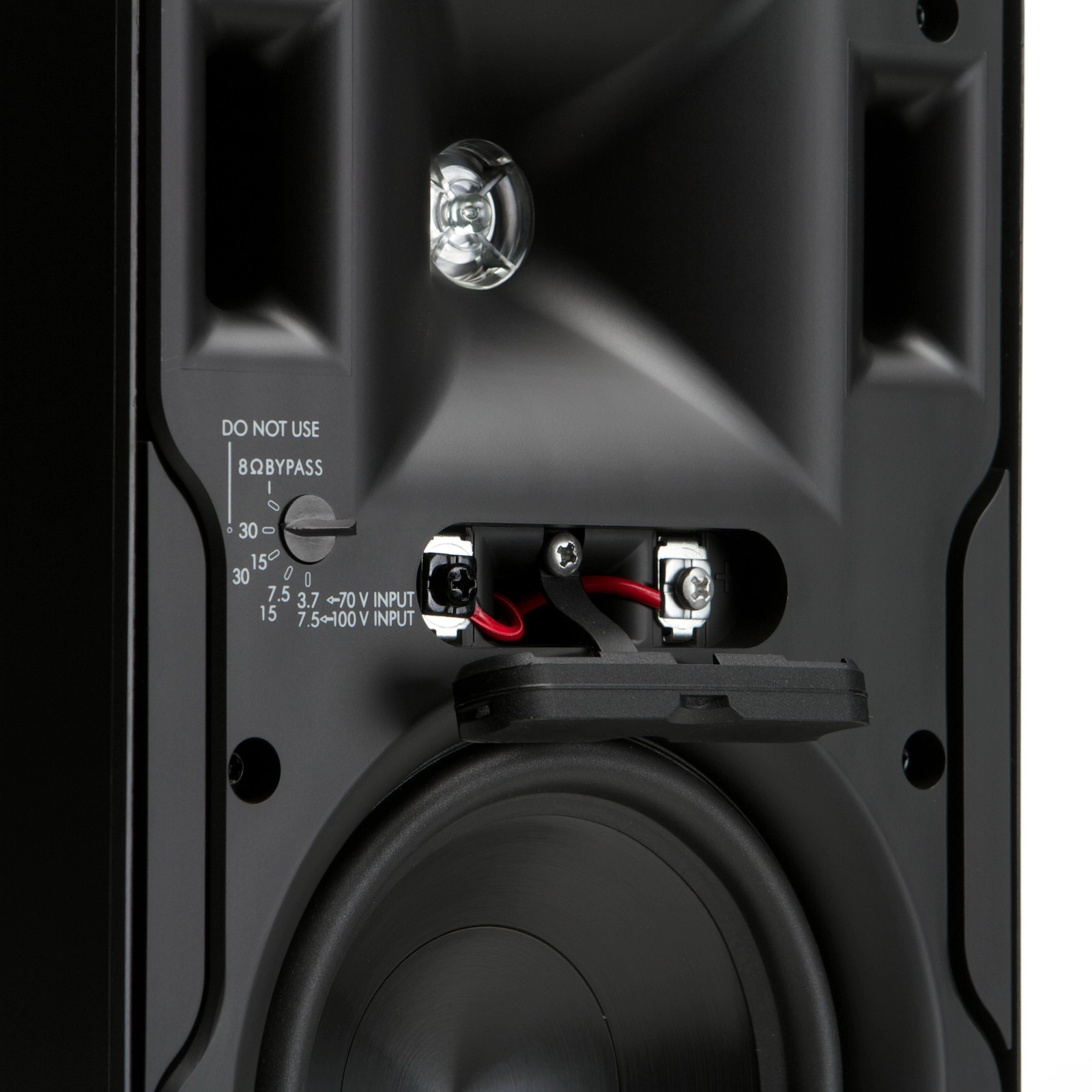 Klipsch Cp-6T Close-up of a black loudspeaker back panel showing 70v/100v input selector, 8ω bypass, and red wires to terminals.