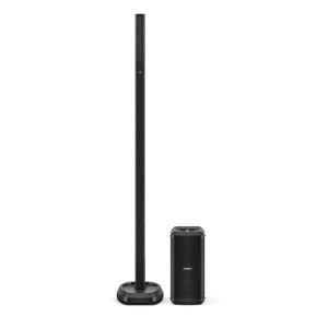 Tall black floor-standing speaker on a round base paired with a compact black subwoofer.