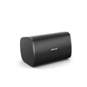 DesignMax DM8SE - A black Bose DesignMax surface-mount speaker positioned horizontally with its front grille visible.