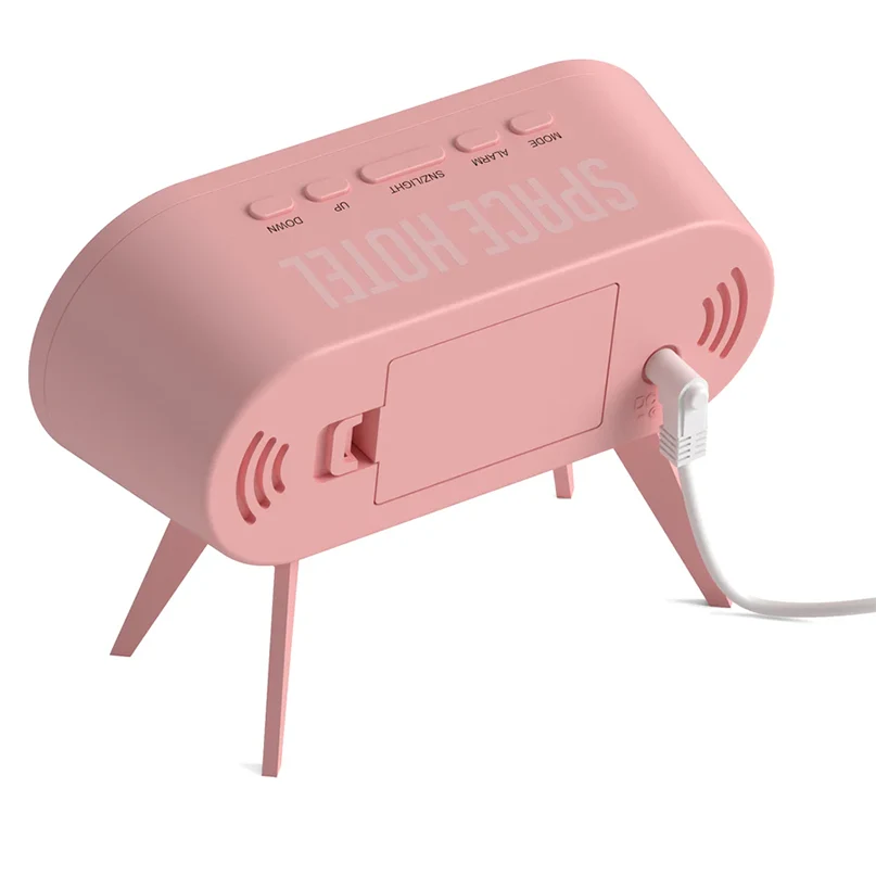 Newgate Space Hotel Cyborg Led Alarm Clock Pink retro alarm clock on two legs with usb charging cable and top control buttons labeled down, up, alarm, snooze/light.