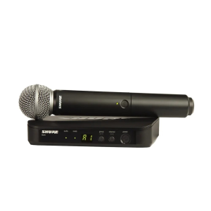 Shure BLX4 wireless microphone system with black handheld microphone and receiver base with LED display.