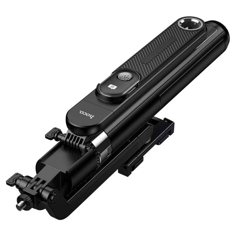 Hoco. Smart Holder “K32 Soporte” Quadropod Face Tracking Hoco. Smart holder “k32 soporte” quadropod face tracking folded black selfie stick with a phone holder and integrated remote control, shown on a white background.