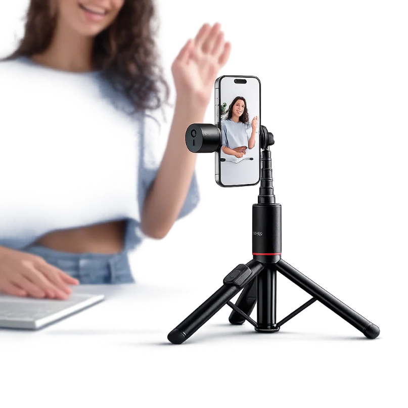 Hoco. K34 All-In-One Live Broadcast Holder The hoco. K34 all-in-one live broadcast holder supports a smartphone as it records a woman waving and smiling while she sits at a desk with her laptop.