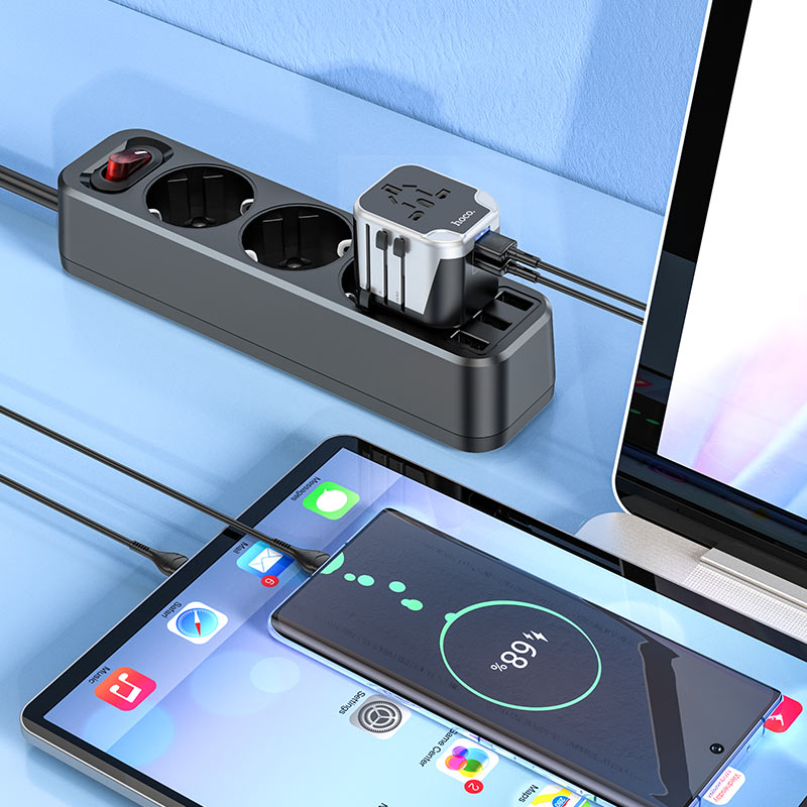 Hoco. Ac5 Dual Usb Universal Charger Adapter A hoco. Ac5 dual usb universal charger adapter sits on a desk with its ports powering a smartphone and a tablet.