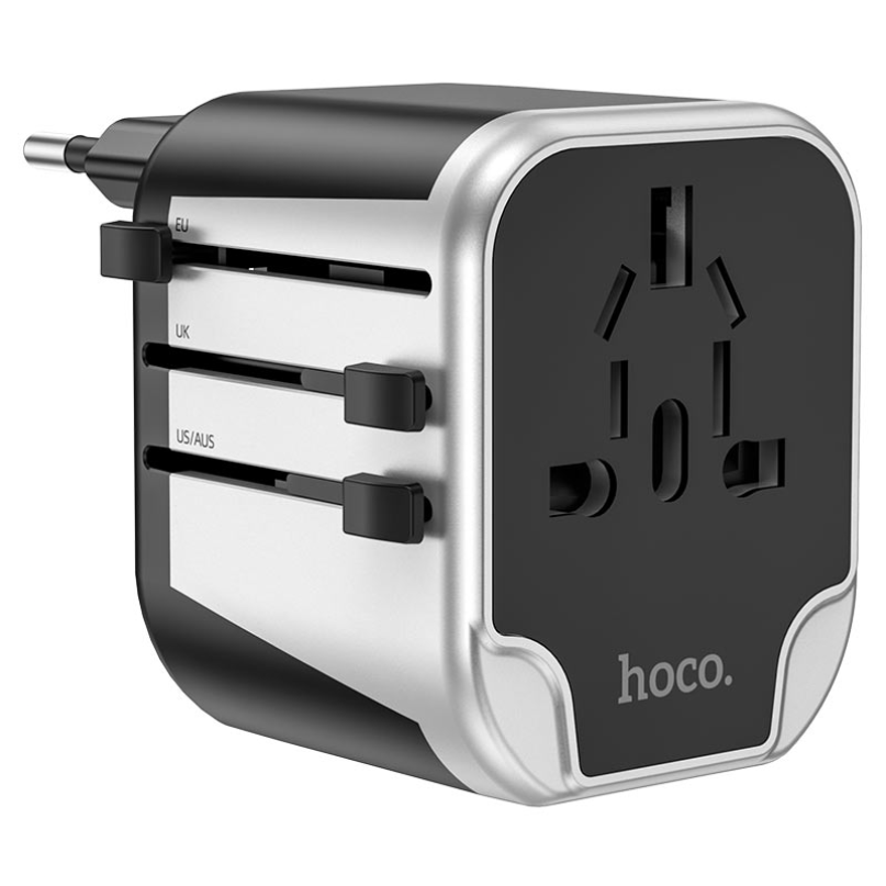 Hoco. Ac5 Dual Usb Universal Charger Adapter Hoco. Ac5 dual usb universal charger adapter with selectable plugs for eu, uk, and us/aus regions, featuring a black and silver design and the brand “hoco. ” visible on the front.