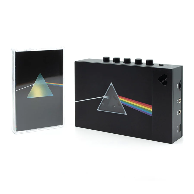 We Are Rewind Limited Edition Pink Floyd Portable Cassette Player &Amp; Recorder Black audio amplifier with prism and rainbow stripe artwork, five top knobs, beside a matching jewel-case.